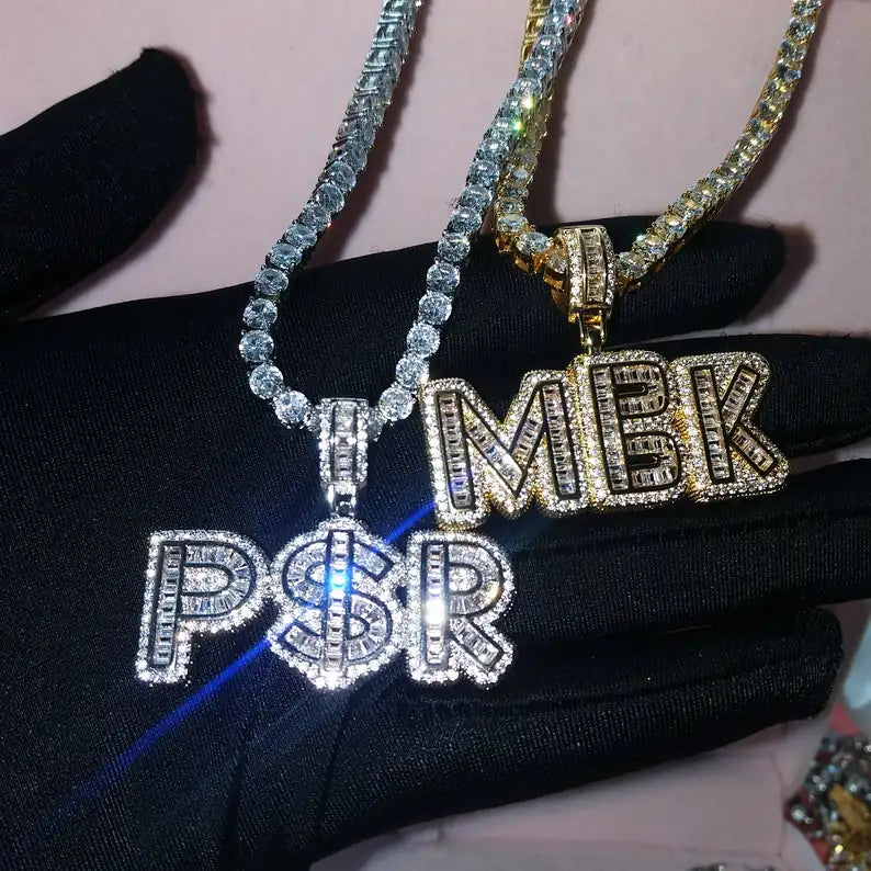 Iced out 5A CZ custom letter pendants PSR and MBK showing diamond-like fire and refractive light