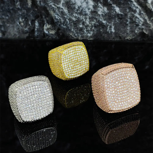 Three iced out square cube signet rings in silver, gold, and rose gold finishes