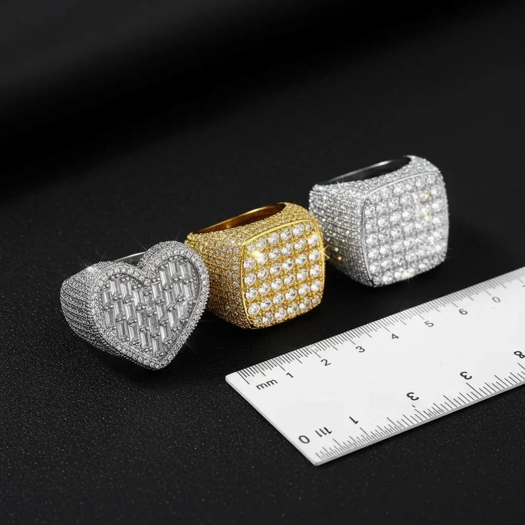 Iced out CZ rings in gold and silver with a paper strip and ruler for ring sizing at home — VibePlugs