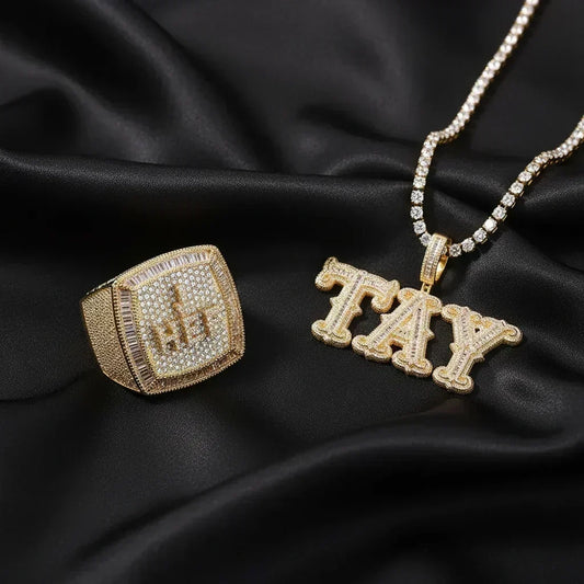 Gold iced out custom name ring and name necklace pendant side by side — CZ stone set hip hop jewelry by VibePlugs